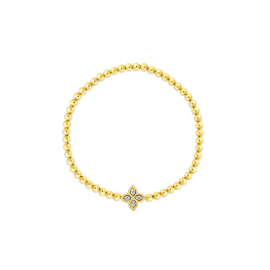 The Roberto Coin Petite Princess Flower Stretch Bracelet dazzles with its delightful diamond-adorned central floral motif, artfully crafted from 18k yellow and white gold.