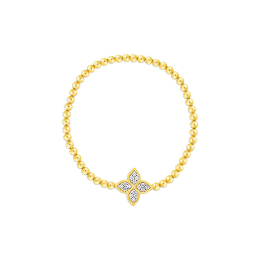 The Roberto Coin Princess Flower 18K Yellow Gold Diamond Stretch Bracelet features a central Princess Flower motif with sparkling diamonds, displayed against a white background.