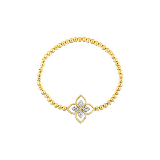Introducing the Roberto Coin Principessa Stretch Bracelet, a luxurious gold beaded bracelet featuring an 18K Yellow Gold central floral pendant embellished with diamond-like accents. This design from Roberto Coin harmoniously combines elegance and simplicity with its symmetrical beauty.