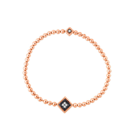 Experience sophistication with the Roberto Coin Palazzo Ducale 18k Rose Gold Stretch Bracelet, featuring a charming diamond-shaped motif inlaid with black and white diamonds. A smaller matching charm enhances its elegant design.