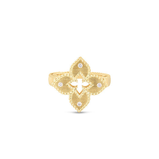 The Roberto Coin Petite Venetian Princess Ring is elegantly crafted from 18k yellow gold and showcases a flower design with four petals, each adorned with a central round diamond. Its textured border highlights the intricate details, while the smooth, polished band adds an element of sophistication to this exquisite piece by Roberto Coin.