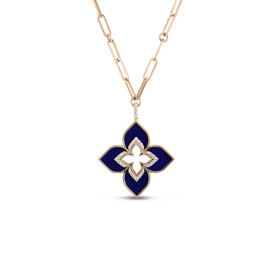 The Roberto Coin Venetian Princess Necklace features an 18K Rose Gold chain with an elegant design, highlighted by a four-petal flower-shaped pendant. The pendant is embellished with deep blue lapis sections and accented with small, sparkling diamonds.