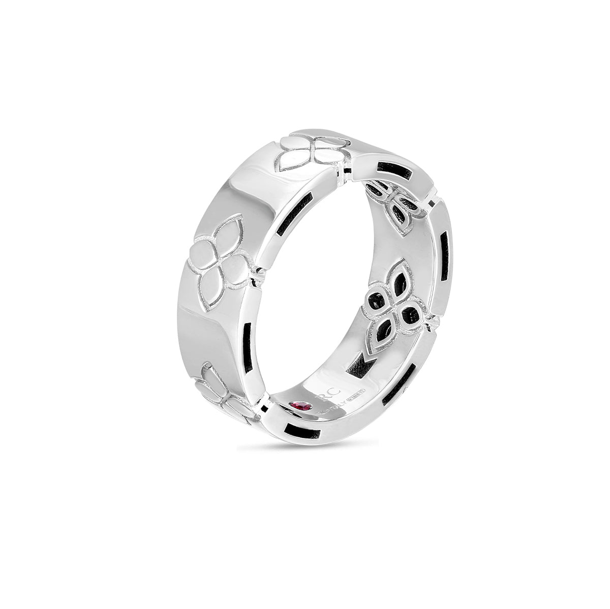 The Roberto Coin Love In Verona 18K White Gold Etched Flowers Wide Ring Band, exhibiting meticulous craftsmanship with engraved floral patterns surrounding its band, is elegantly showcased against a white background. This piece resonates with the timeless charm of Love In Verona.