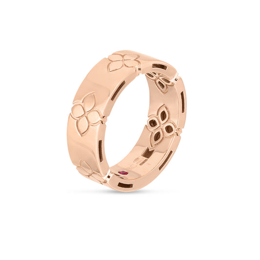 Roberto Coin Love In Verona 18K Rose Gold Etched Flowers Wide Ring Band showcasing delicate floral patterns and a small red gemstone on the inner side.