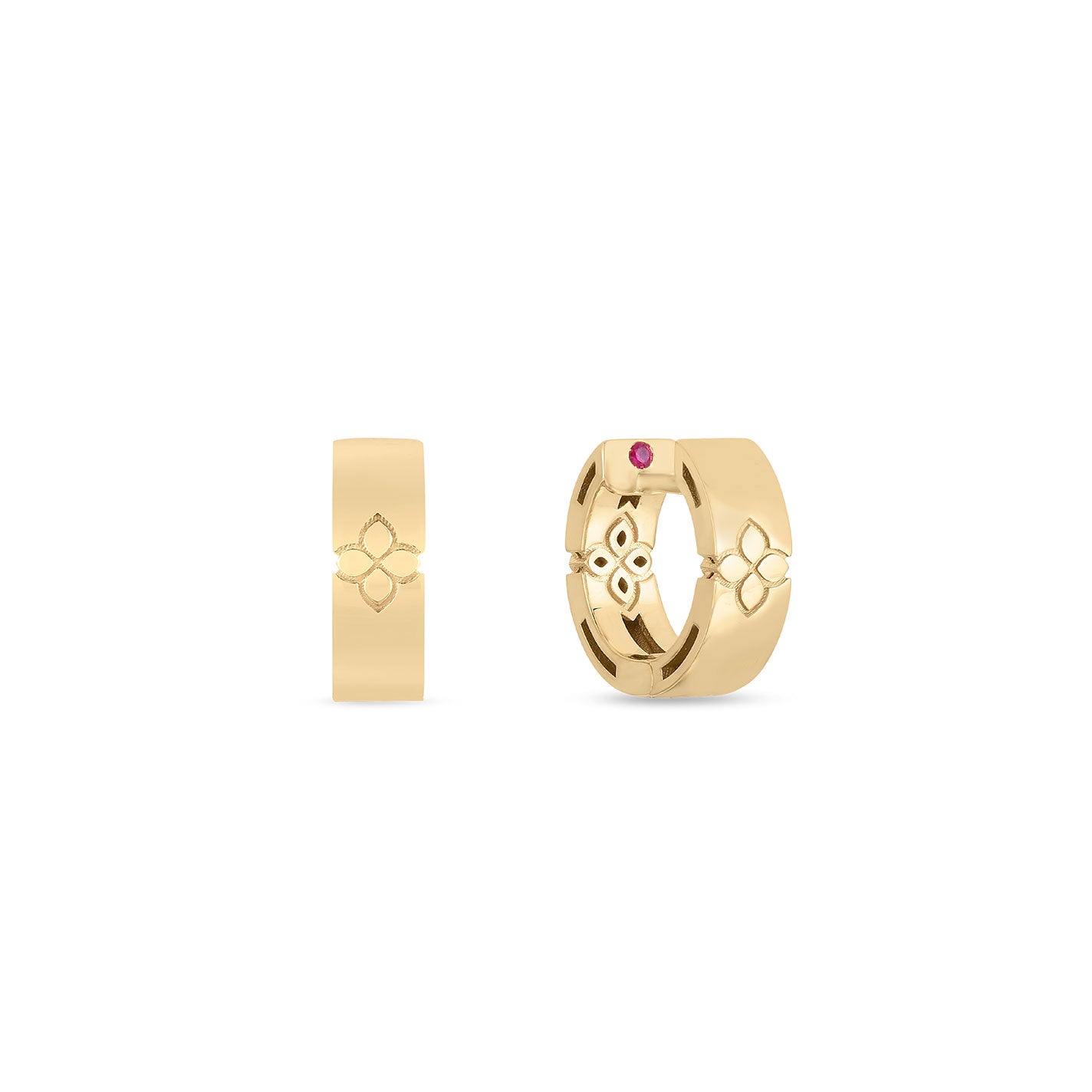 Two 18K yellow gold hoop earrings are displayed, each featuring a decorative floral pattern reflective of Roberto Coin's Love In Verona collection. The earring on the right is distinguished by a small red gemstone inset. Both earrings showcase a polished finish against a plain white background.