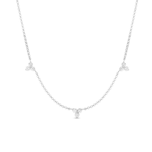 The Roberto Coin Diamonds by the Inch 18K White Gold Three Stations Necklace showcases a minimalist design with three small clusters of sparkling gemstones elegantly spaced along the chain, similar to Roberto Coin's signature style, for a refined and sophisticated appearance.