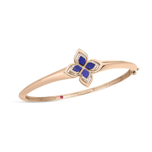 From the Roberto Coin Venetian Princess Collection, this exquisite bracelet features a flower-shaped design with blue petals crafted from lapis and adorned with silver accents. Made from 18K Rosé Gold, it also includes a small red jewel for added elegance.