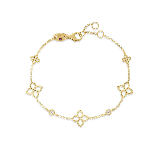 The Roberto Coin Princess Flower 18K Yellow Gold Diamond Station Bracelet features five floral-shaped charms with diamond accents, fine detailing, and an adjustable clasp—signature elegance from Roberto Coin.