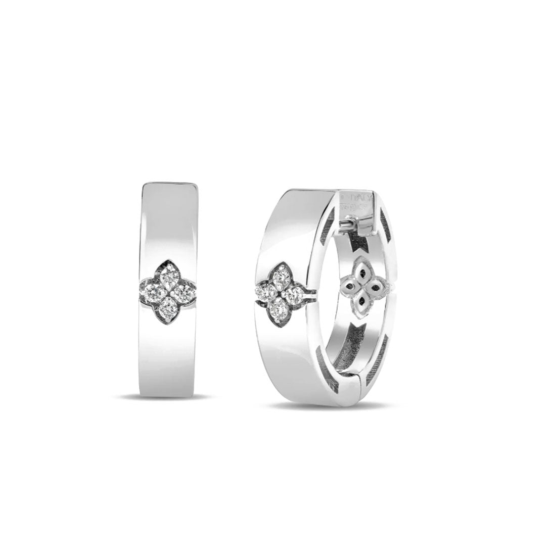 The Roberto Coin Love in Verona 18K White Gold Diamond Small Hoop Earrings feature a four-petal floral motif with diamond accents, a polished finish, and hinged closure for a refined touch.