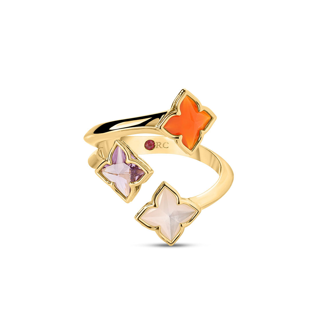 The Roberto Coin Venetian Princess Carnival Ring features an open spiral design in 18K yellow gold, set with four flower-shaped gems—red agate, amethyst, pink, and white stones—in elegant gold bezels.