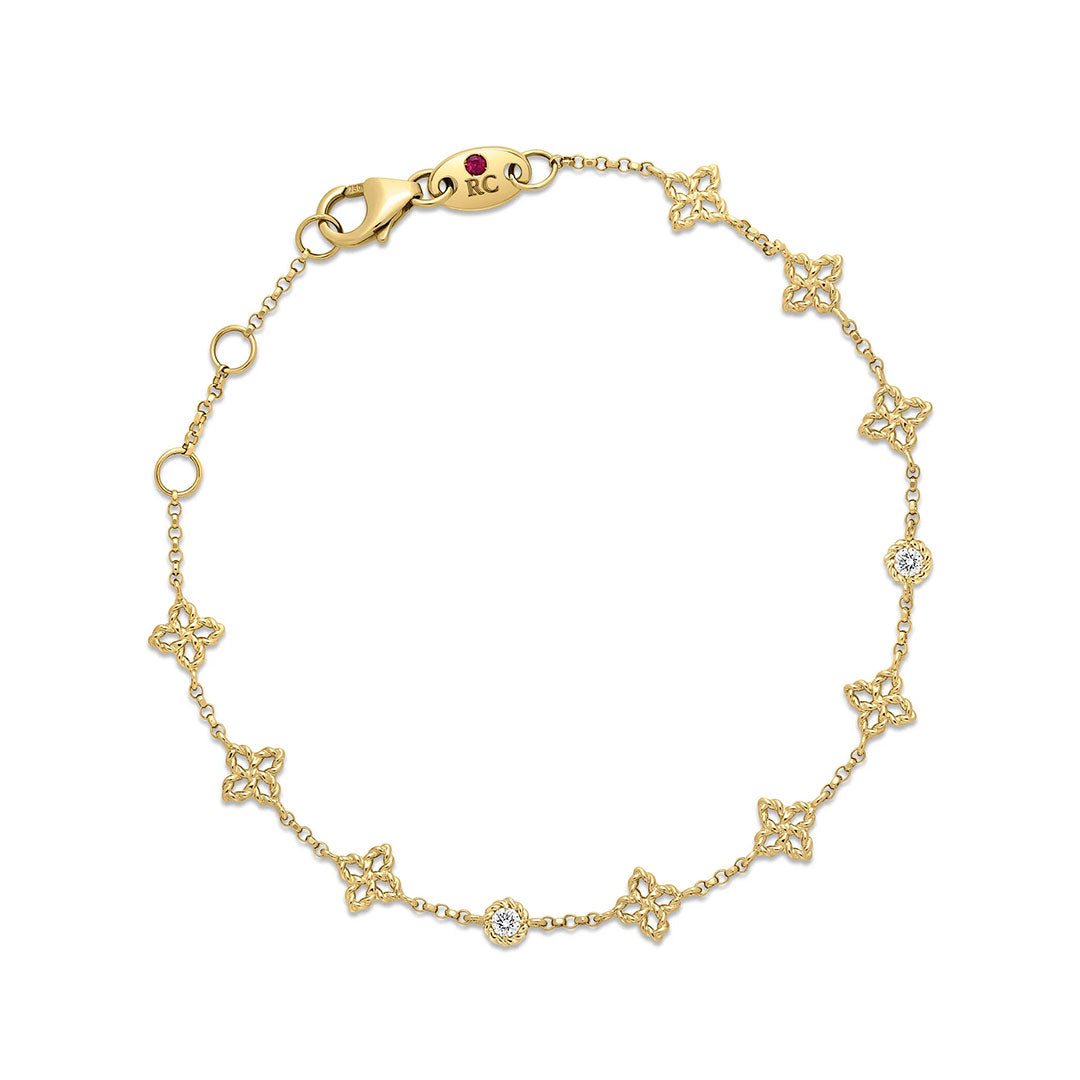 Roberto Coin Princess Flower 18K Yellow Gold Diamond Station Bracelet features delicate flower-shaped stations adorned with sparkling diamonds, expertly crafted in 18K yellow gold and secured with a lobster clasp closure.