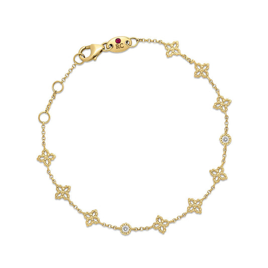 Roberto Coin Princess Flower 18K Yellow Gold Diamond Station Bracelet features delicate flower-shaped stations adorned with sparkling diamonds, expertly crafted in 18K yellow gold and secured with a lobster clasp closure.