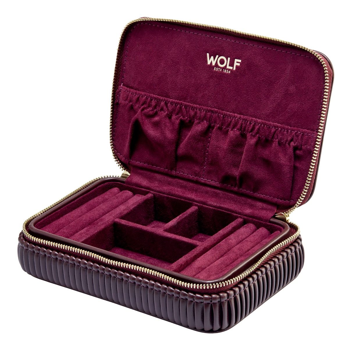 The WOLF 1834 Bella Zip Jewellery Case is a burgundy organizer with a ribbed exterior, velvety interior, and compartments for rings, earrings, and more. The WOLF brand name is embossed on the upper lid.