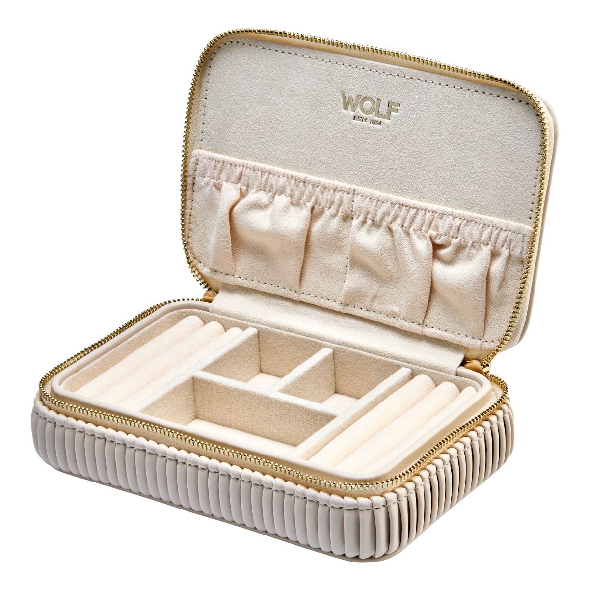 The WOLF 1834 Bella Zip Jewellery Case, in beige with soft fabric lining, multiple compartments, and ring rolls, sits open. "WOLF" is stamped in gold lettering inside the lid.