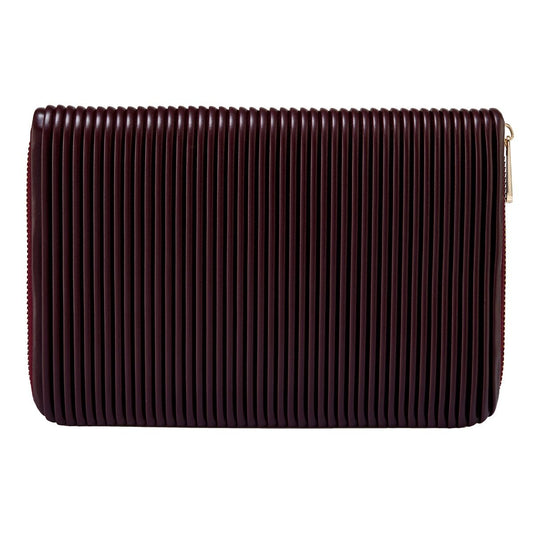 The WOLF 1834 Bella Jewellery Portfolio by WOLF is a rectangular, dark brown clutch with a vertical ribbed texture and a right-side zipper closure, perfect for organizing your jewelry during travel.