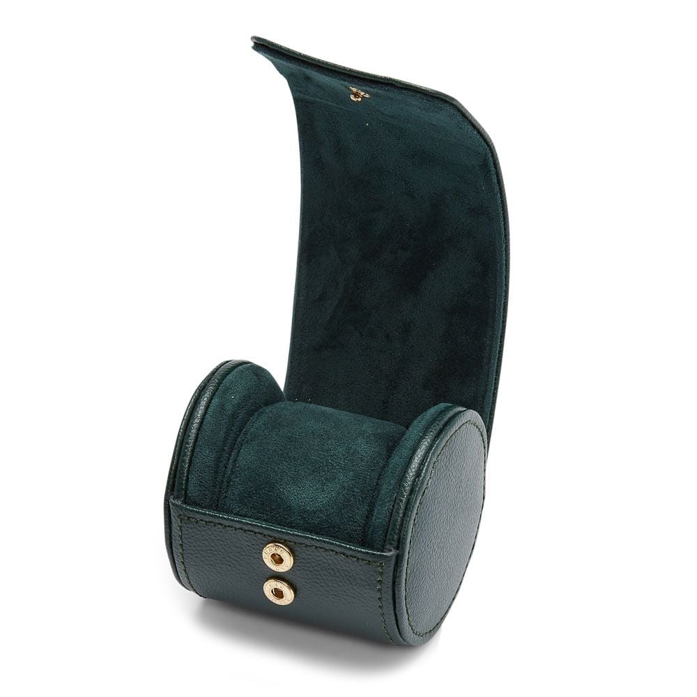 The WOLF 1834 British Racing Single Watch Roll by WOLF is a dark green vegan leather case with a suede interior, shown open with a curved lid and two gold snap buttons for a sleek, compact look.