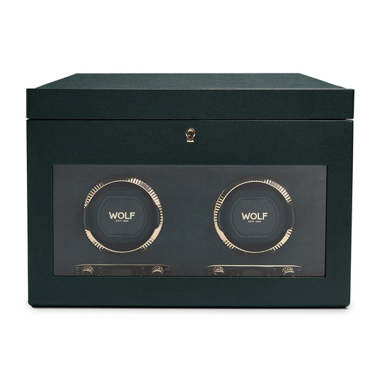 The WOLF 1834 British Racing Green Double Winder, crafted from green vegan leather, features a transparent front panel that highlights two circular compartments for watches. Embellished with gold accents, it exudes the elegance of British Racing style and prominently displays the brand name "WOLF" on each compartment.