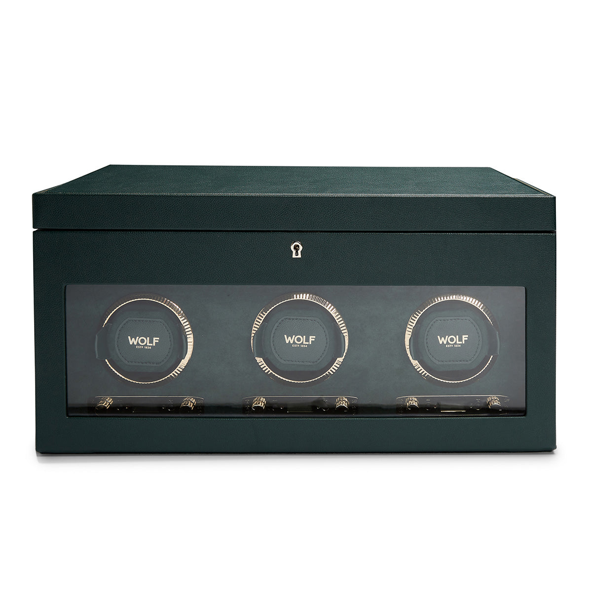 A stylish green watch winder, constructed with vegan leather, showcases three circular watch holders visible through a glass front. The brand "WOLF" is elegantly displayed on each holder, featuring a modern and minimalist design complemented by a subtle lock symbol above the panel.