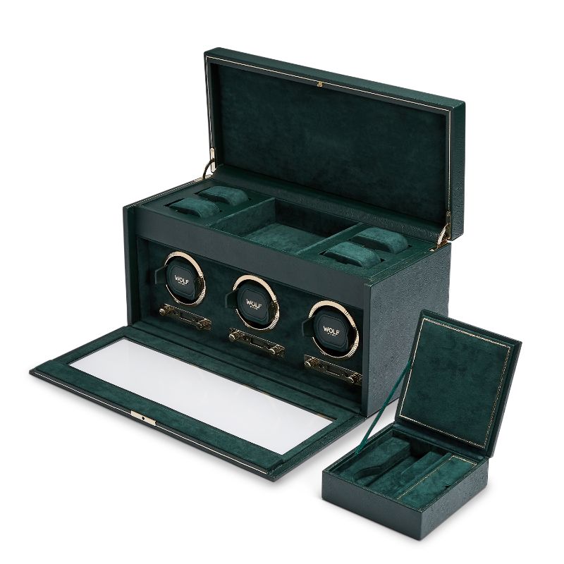 The WOLF 1834 British Racing Green Triple Winder by WOLF features a lush vegan leather design with an open lid that showcases three watch holders inside. The elegant case comes with a glass front and includes a matching smaller box, also open, revealing compartments lined with green fabric.