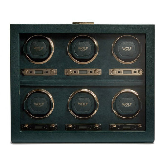 The WOLF 1834 British Racing 6PC Watch Winder is a classic design featuring six slots, each with a circular cushion inscribed with "WOLF." The interior matches the British Racing Green leather exterior, while gold hardware adds a touch of sophistication for adjustments.