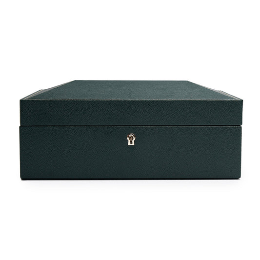 The WOLF 1834 British Racing Green 8 Piece Watch Box features a secure keyhole on its front and is crafted from textured vegan leather. Its closed, dark green design sits gracefully against a plain white background, making it an ideal choice for those who appreciate elegance with an eco-friendly twist.