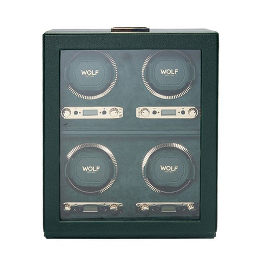 Introducing the WOLF 1834 British Racing 4PC Watch Winder, showcasing a British Racing Green design with a transparent front that elegantly displays four WOLF winders arranged in a 2x2 grid. Each winder is equipped with circular holders and digital controls, beautifully lined in matching green.