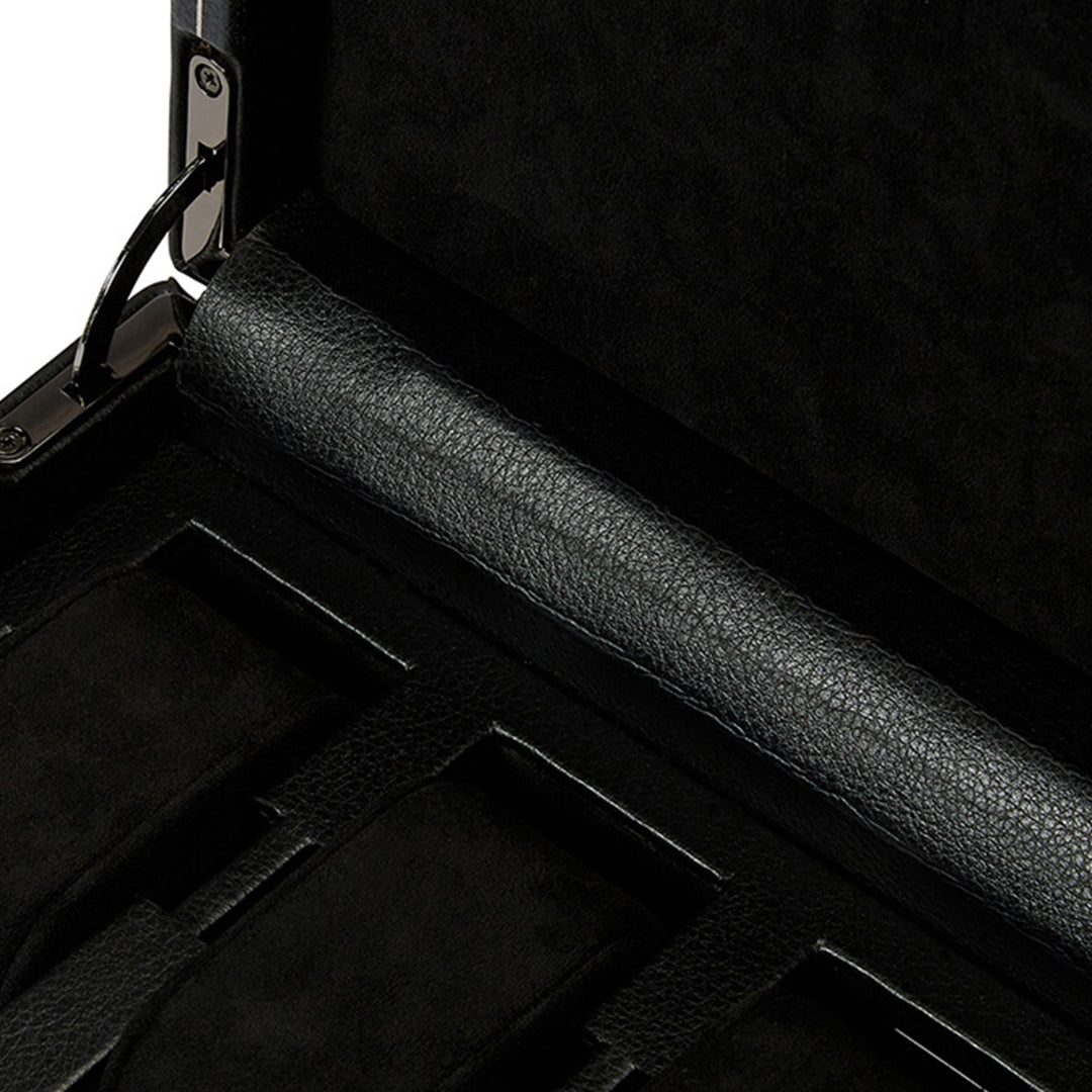 Close-up of the interior of an open WOLF 1834 British Racing 15 Piece Watch Box, showcasing various compartments with a textured lining and metal hinges.