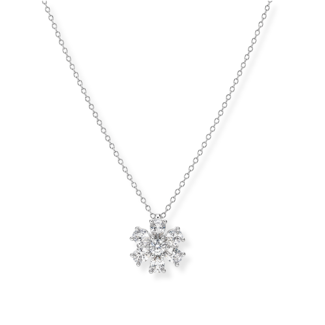 A delicate Raffi&Co.® 14K White Gold Diamond Necklace Pendant featuring a sparkling, snowflake-shaped design adorned with multiple small clear diamonds of F/G color and VS1-VS2 clarity, displayed on a white background.