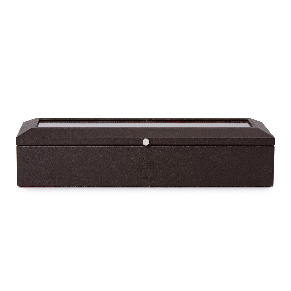 The WOLF 1834 WM Brown 5 Piece Watch Box, a creation from the WOLF collaboration, displays a black rectangular design with a transparent top and is adorned with a silver button at its center. It is elegantly positioned against a plain white background.