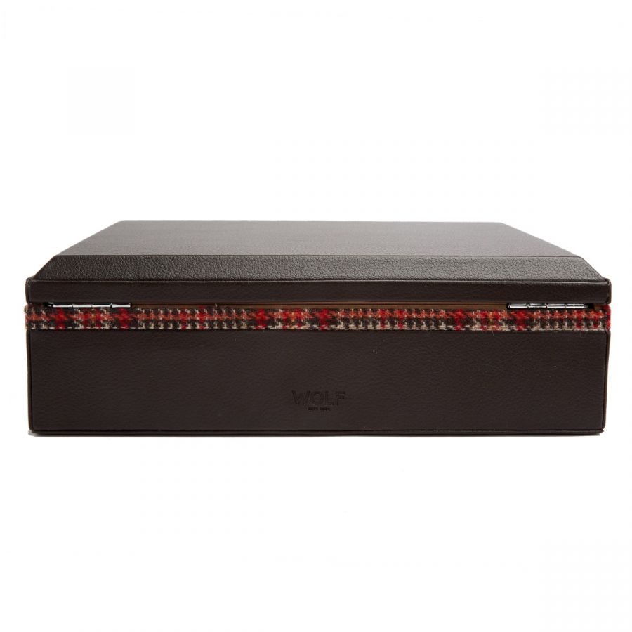 The WOLF 1834 WM Brown Humidor is a closed, rectangular storage box featuring a brown textured finish and a stylish red and gray houndstooth pattern along the side. Designed for the modern man, it includes a hinged lid and is subtly branded with a logo, seamlessly blending fashion with function.