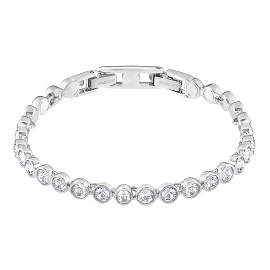 The Swarovski Tennis Bracelet by Swarovski is elegantly embellished with round cut crystals, perfectly spaced along its rhodium-plated band and features a clasp at the top.