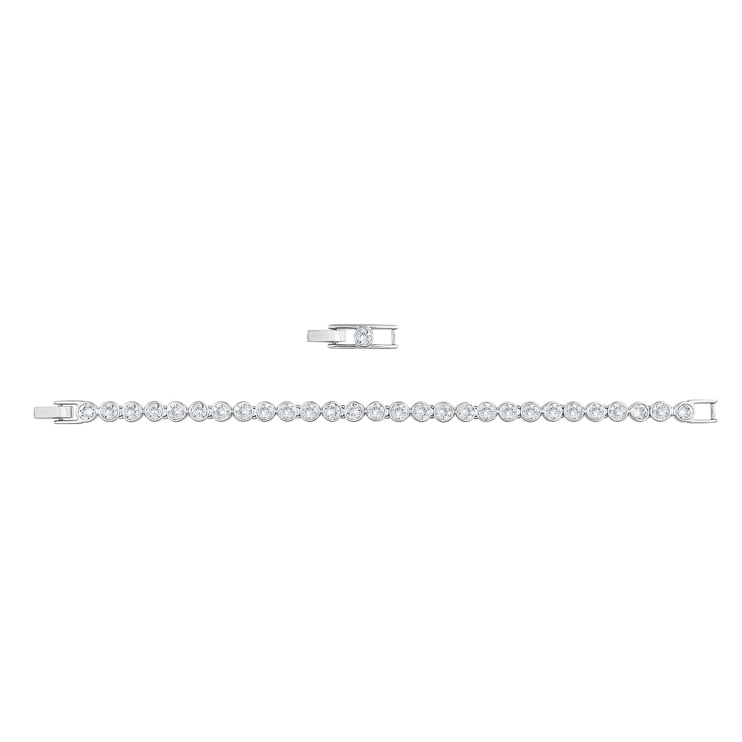 The Swarovski Tennis Bracelet showcases dazzling round-cut crystals set in a sleek silver design. With rhodium plating for extra luster, this sophisticated piece features a symmetrical layout and a small matching clasp that enhances the sparkle of each gemstone.