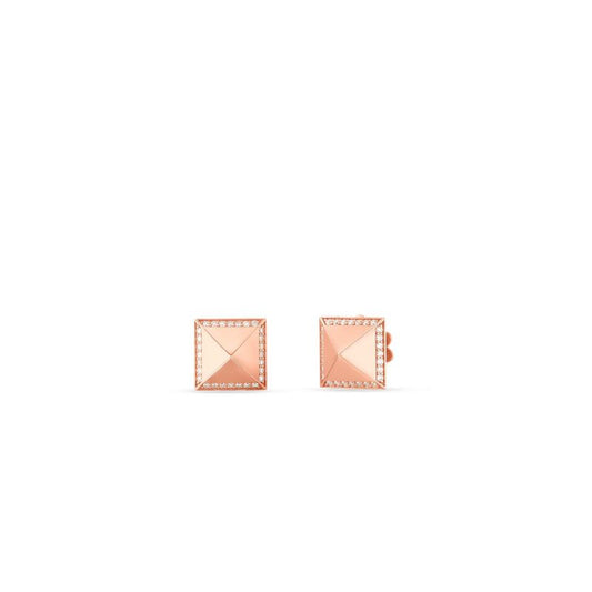 The Roberto Coin Obelisco 18K Rose Gold Diamond Stud Earrings, designed in a square shape with a pyramid motif, rest on a white background. Delicate detailing borders each earring, enhancing their elegance.