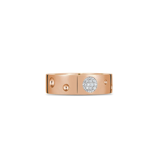 The Roberto Coin Pois Moi Luna 18K Rose Gold Diamond Accent Ring is an exquisite piece crafted from 18K rose gold. It features small circular engravings and a cluster of tiny diamonds at the center, boasting a polished finish that embodies a modern, minimalist design.