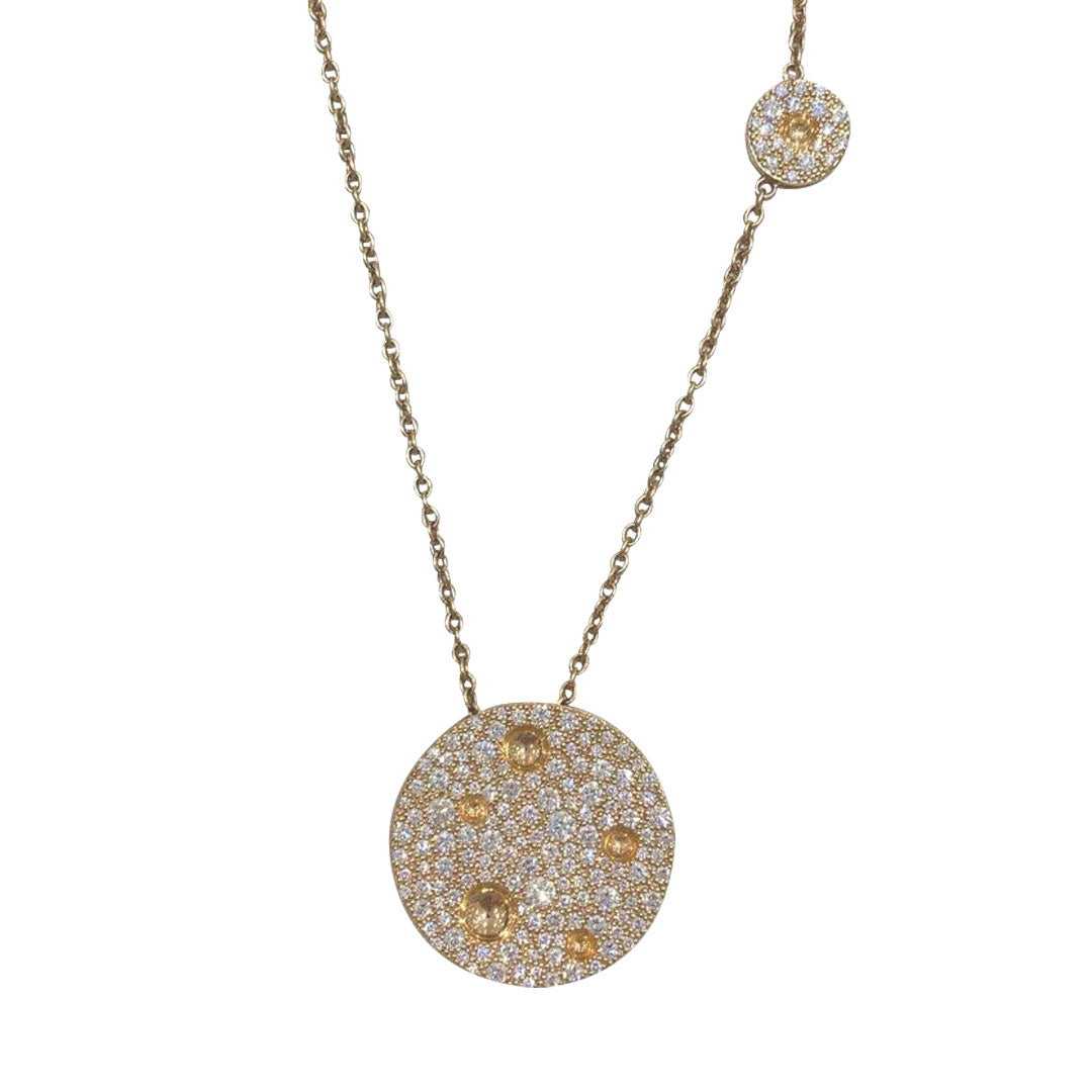 The Roberto Coin Pois Moi Luna 18K Rose Gold Diamond Necklace Pendant showcases a gold necklace featuring a circular pendant embellished with small, sparkling crystals, crafted in exquisite 18K rose gold. A smaller round charm is elegantly attached above on the chain, embodying a delicate and graceful design characteristic of Roberto Coin's luxurious aesthetic.