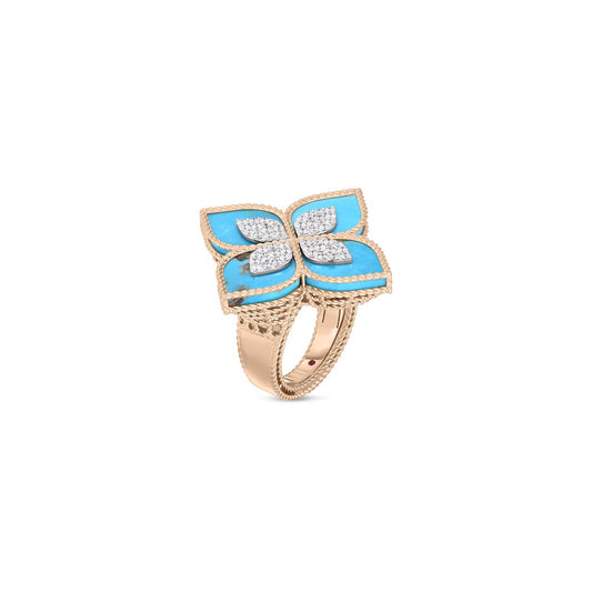 The Roberto Coin Venetian Princess ring is a stunning piece crafted in 18K rose gold, showcasing a floral motif with four turquoise petals outlined in rose gold and accented by small diamonds at the center, all set on a textured gold band.