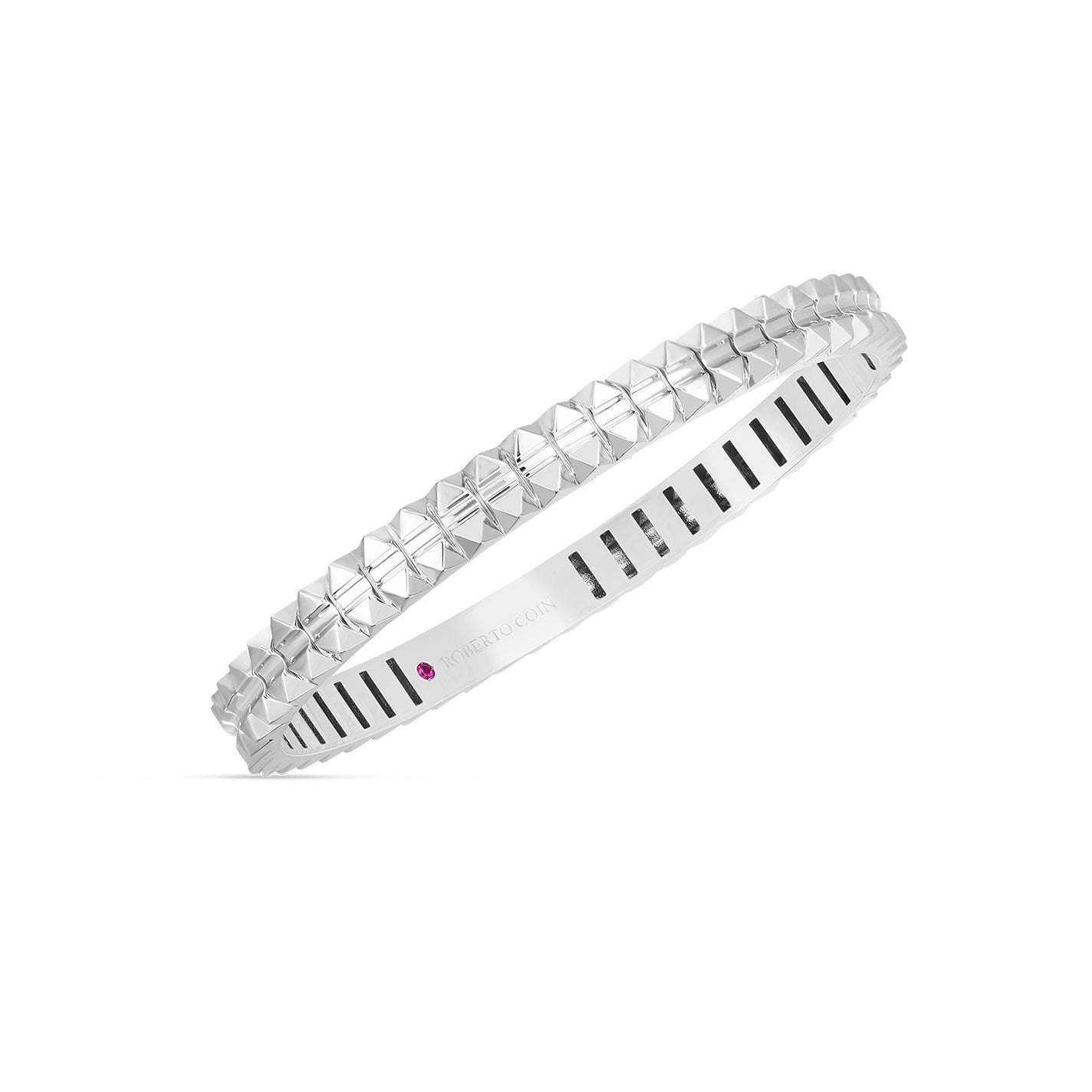 Introducing the Roberto Coin Oblesico 18K White Gold Hinged Bangle, a sophisticated piece from the esteemed brand, featuring geometric pyramid-shaped studs and a subtle hint of red gemstone. The inner surface is designed with smooth parallel grooves for comfort.