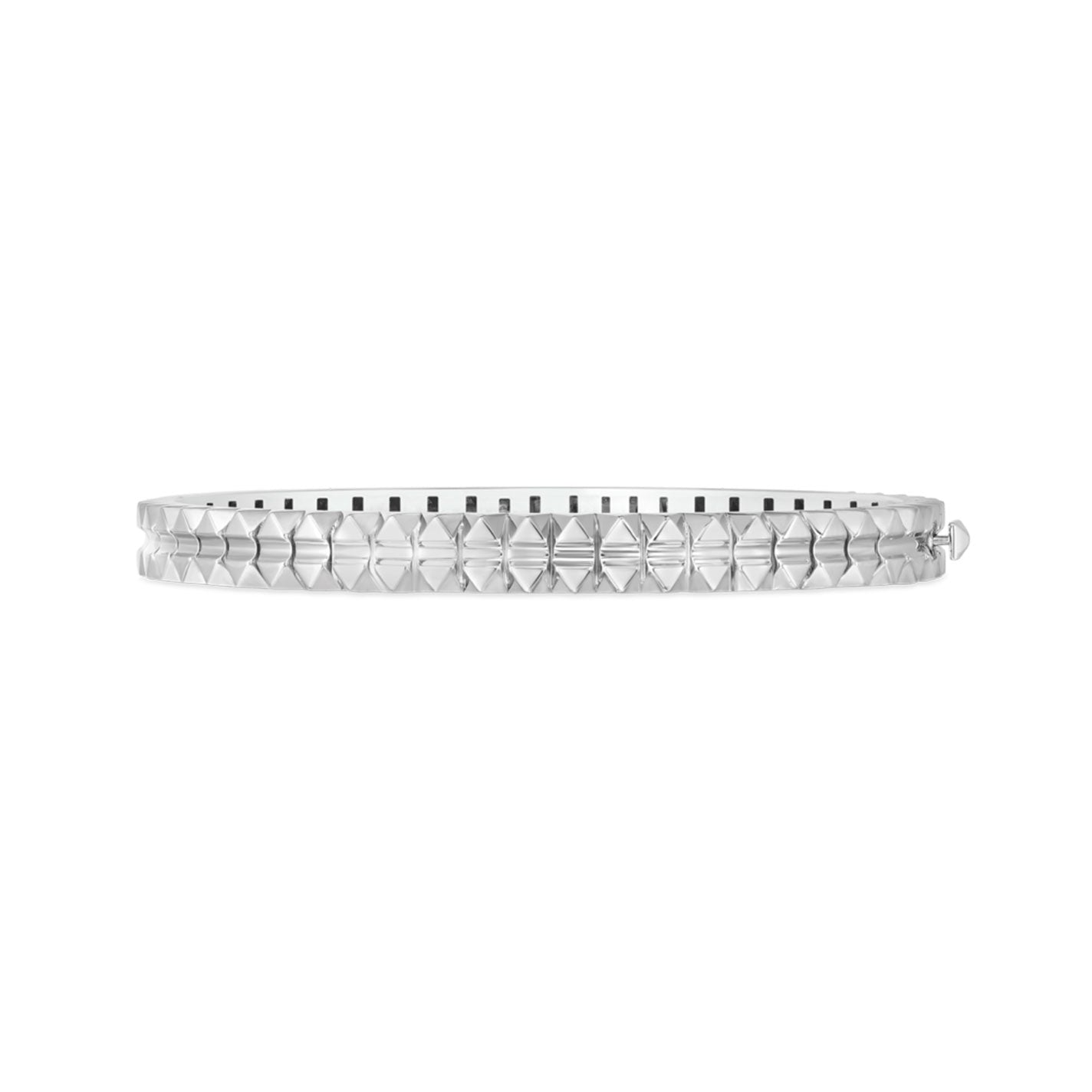 This Roberto Coin Oblesico 18K White Gold Hinged Bangle, from the Obelisco Collection, features a sleek geometric design with faceted detailing. The surface is adorned with raised diamond shapes that create a reflective pattern, elegantly contrasted against a white backdrop.