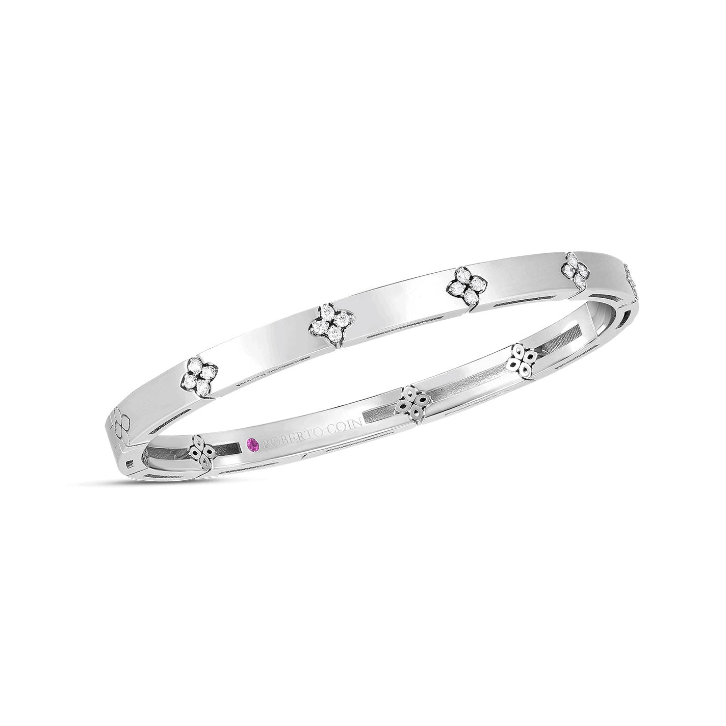 The Roberto Coin Love In Verona 18K White Gold Narrow Width Diamond Accent Bangle features a sleek design with floral motifs evenly spaced around its polished surface. This elegant piece, crafted from 18k white gold, is perfect for formal occasions.