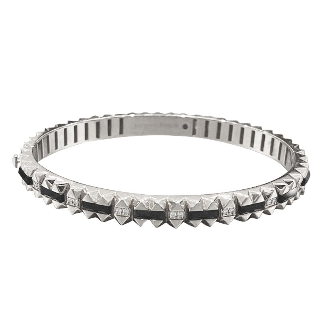 This elegant Roberto Coin Obelisco bangle, crafted in 18K white gold, features a geometric studded design with alternating black and clear sections. It showcases the modern sophistication typical of a Black Jade and Diamond Bangle.