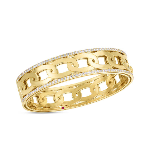 Introducing the Roberto Coin Navarra 18K Yellow Gold Diamond Wide Bangle, a luxurious gold chain-link bracelet expertly crafted with 18K yellow gold. This exquisite piece features round diamond accents along the edges and showcases a sleek design of bold, interlocking links. The bangle is finished with a polished surface and includes a discreet red gemstone detail on the inner side for an extra touch of elegance.