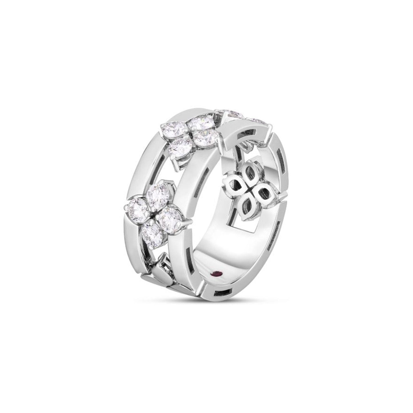 The Roberto Coin Love In Verona 18K White Gold Diamond Open Frame Ring features intricate designs with four clusters of small, round diamonds arranged in floral shapes. Its wide band is adorned with detailed cutouts and a polished finish, embodying elegance and artistry.