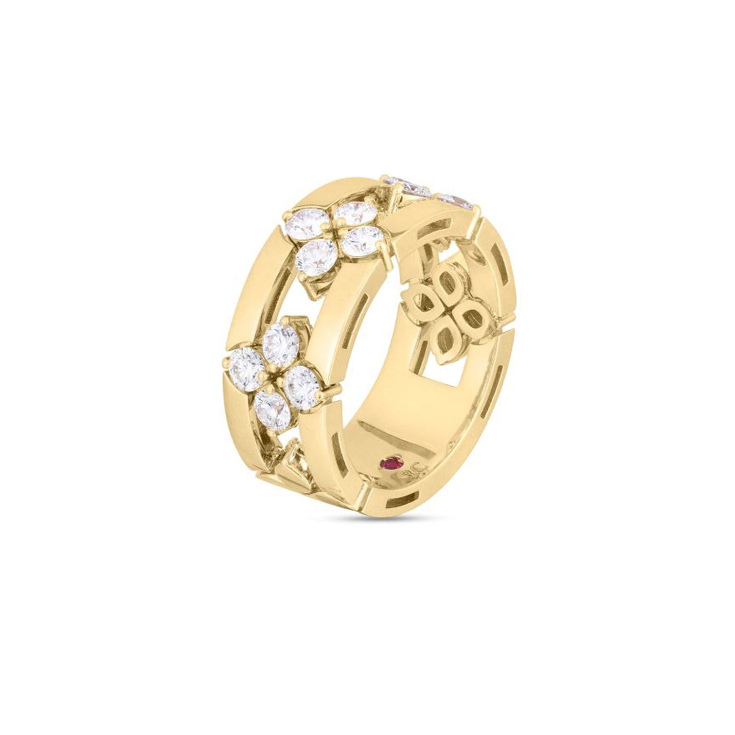 The Roberto Coin Love In Verona 18K Yellow Gold Diamond Open Frame Ring demonstrates exquisite craftsmanship, featuring two floral designs adorned with sparkling diamonds. Intricate cut-out patterns encase a small red gemstone inside, set against a plain white background to highlight every stunning detail.