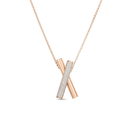 The Roberto Coin Domino 18K Rose Gold Diamond Crossover Necklace Pendant showcases a pair of intersecting cylindrical pendants, one elegantly smooth and the other adorned with sparkling diamonds, set against a pristine white background.