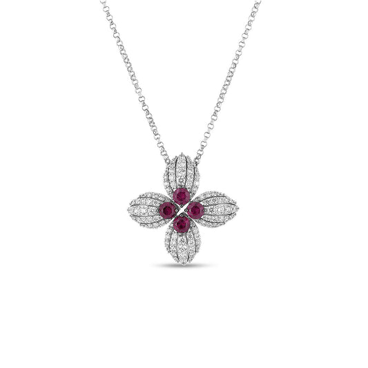 Introducing the Roberto Coin Love in Verona Necklace: a stunning floral pendant crafted from 18K white gold. This exquisite piece features four silver petals embellished with sparkling diamonds, while its center showcases four round red rubies, all elegantly presented on a delicate chain.