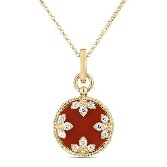 The Roberto Coin Venetian Medallions 18K Yellow Gold Medium Necklace Pendant features a round red agate center with diamond accents, crafted with a rope-style edge in an elegant floral motif.