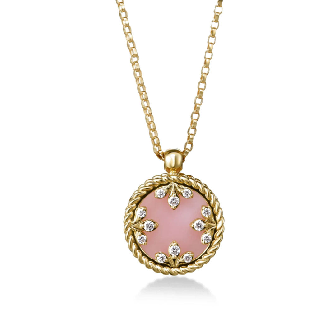 The Roberto Coin Venetian Medallions necklace features a small round pink mother of pearl pendant framed by twisted 18K yellow gold, adorned with diamond accents in a floral pattern.