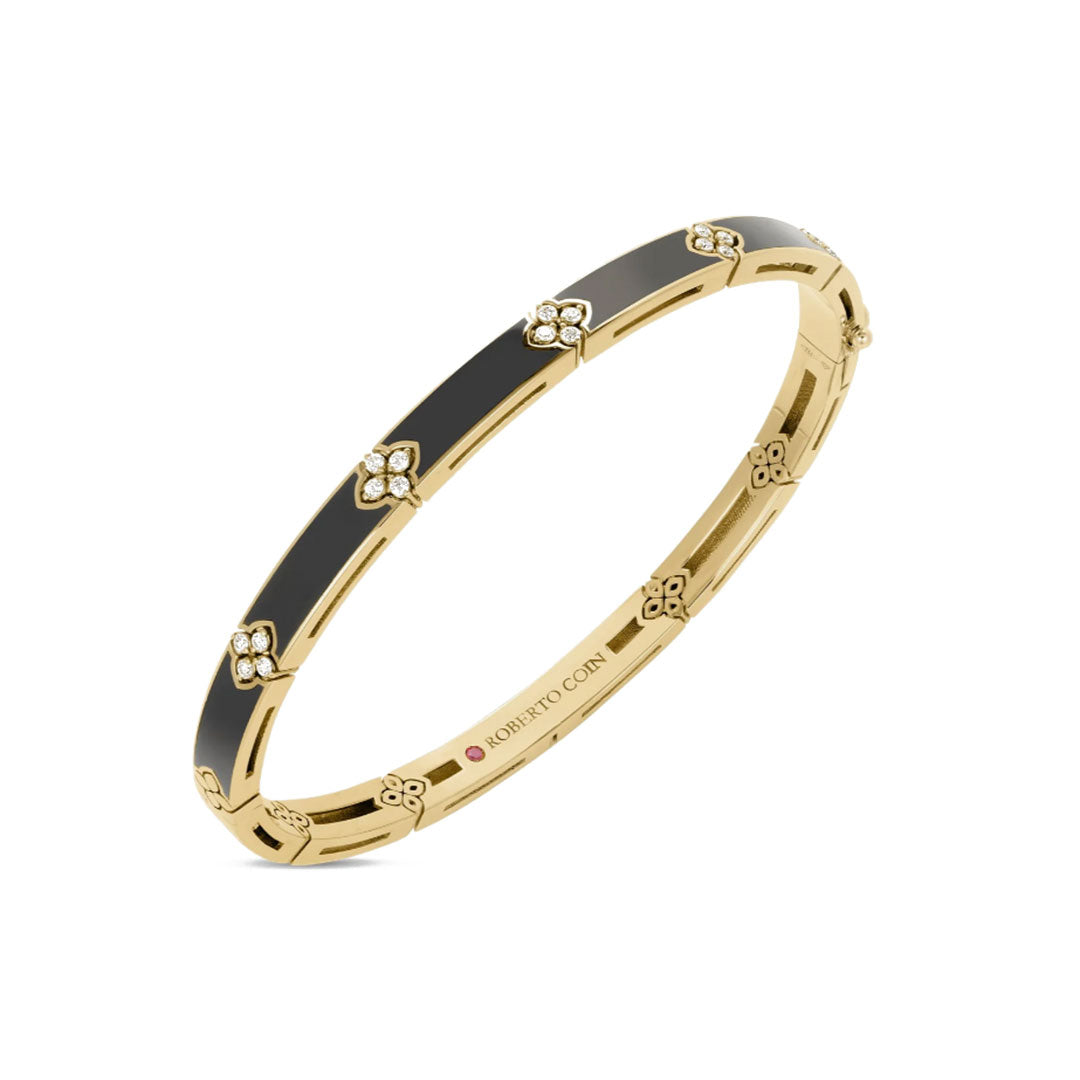 The Roberto Coin Love In Verona 18K Yellow Gold Diamond and Enamel Bangle features black enamel, floral diamond accents, and an engraved "Roberto Coin" logo on the inside.