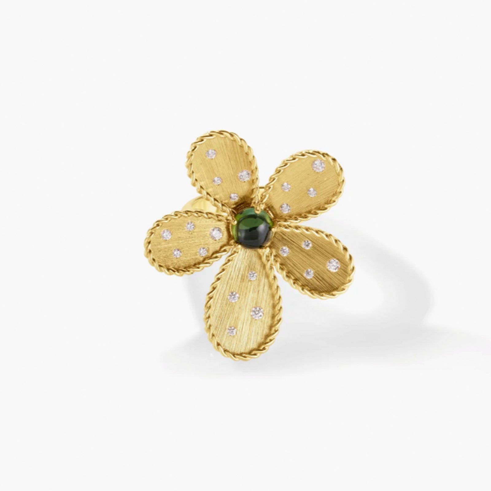 The Roberto Coin Jasmine 18K Yellow Gold Diamond and Green Tourmaline Flower Ring features textured, braided petals with diamonds and a green tourmaline center, casting a soft shadow on a white background.