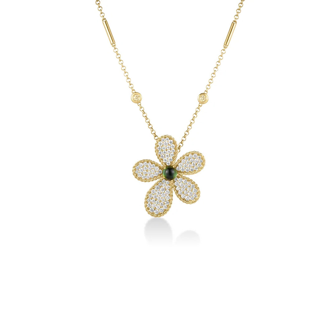 The Roberto Coin Jasmine 18K yellow gold necklace features a large daisy-shaped pendant adorned with five pavé diamond petals and a dark green tourmaline gemstone at its center. The chain is accented with small round diamonds on each side.